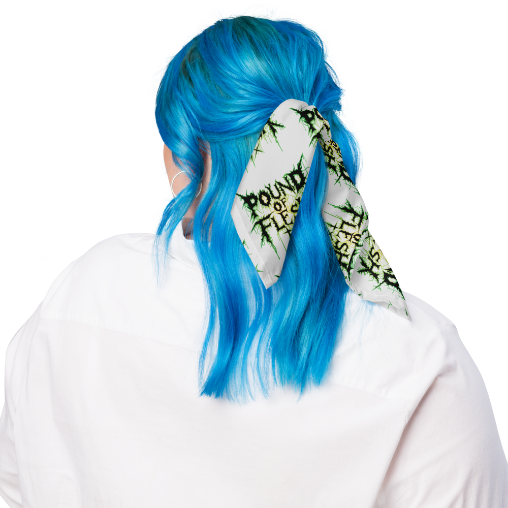 Woman wearing a white bandana with the Pound of Flesh TX Logo outlined in green and yellow in a pattern in her hair.